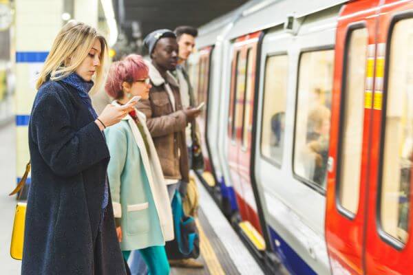 Beneath the Bustling City: Exploring The London Underground 3 Passengers getting on a tube train
