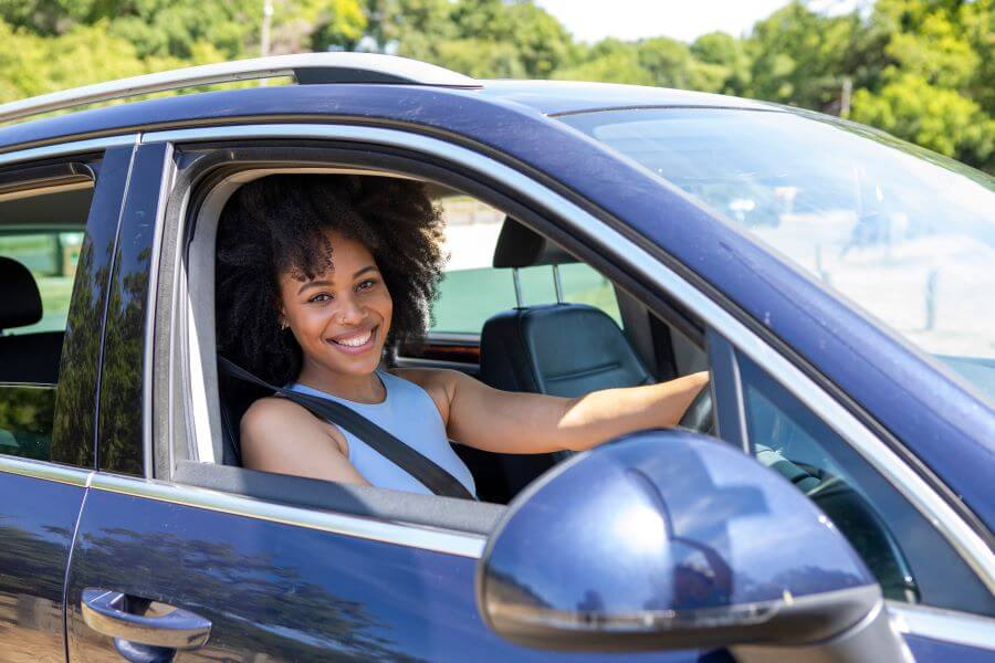 The Five Benefits of Buying Used Cars for New Drivers 2 woman driving a car in london