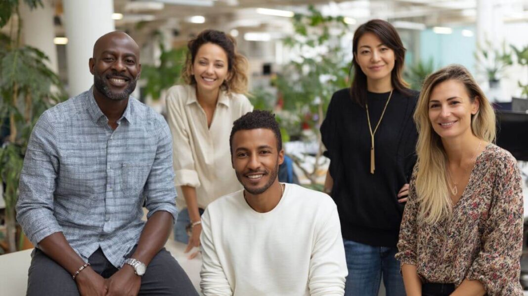 diverse group of professionals in an office with greenery